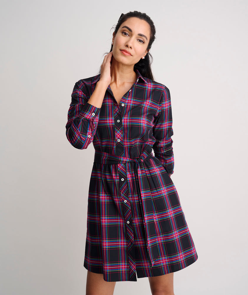 Model is wearing UNTUCKit Cassie dress in purple plaid. 