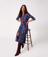 Model is wearing UNTUCKit Joni plaid navy dress.