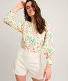 Model is wearing UNTUCKit Carrie Floral Shirt.