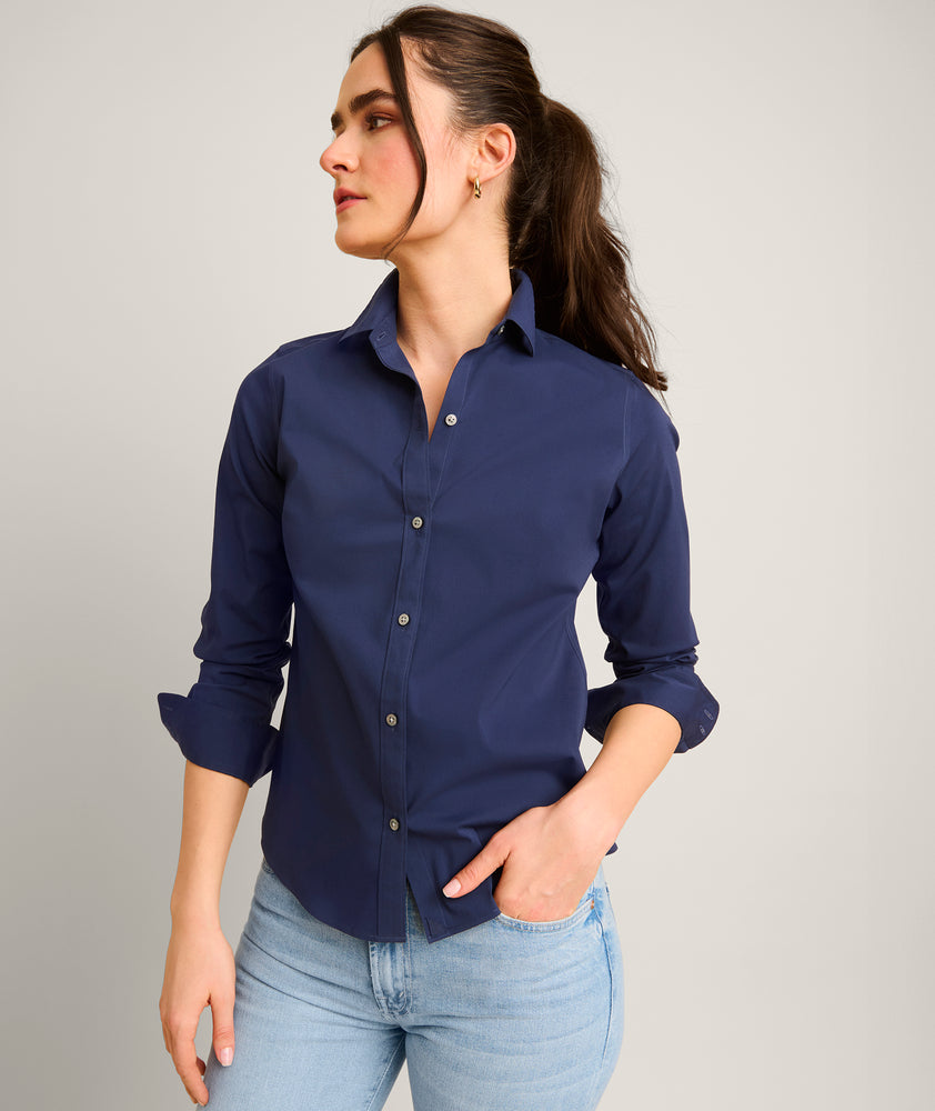 Model is wearing UNTUCKit Bella shirt in navy.