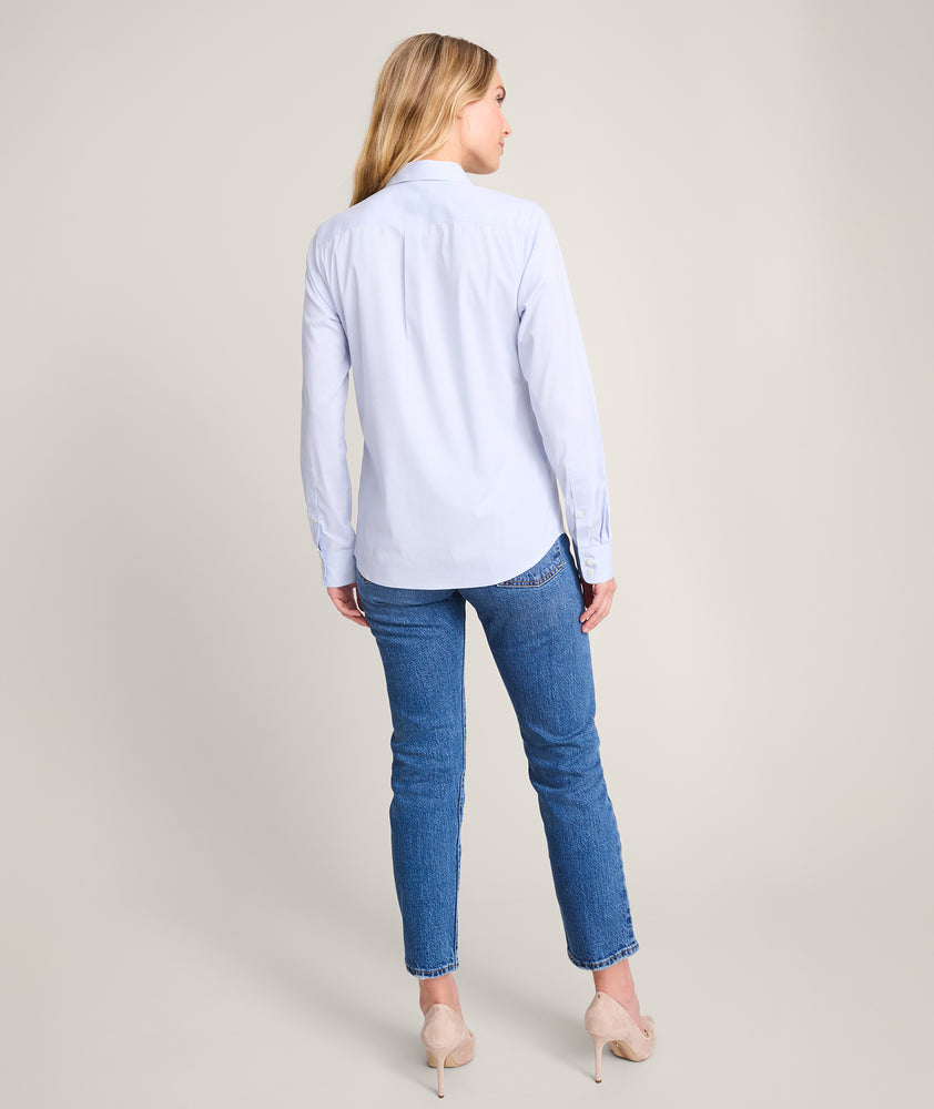 Model is wearing UNTUCKit Bella shirt in blue. 