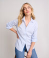 Model is wearing UNTUCKit Bella shirt in blue. 