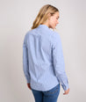 Model is wearing UNTUCKit  Wrinkle-Free Stretch Cotton Bella Shirt in blue and white stripe.