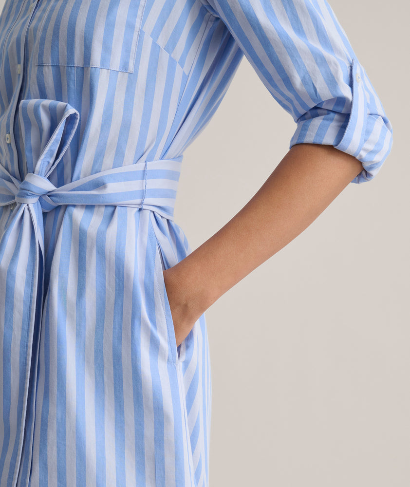 Model us wearing UNTUCKit Adel dress in blue stripped. 