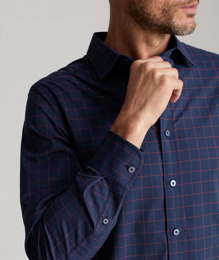 Model is wearing UNTUCKit Wrinkle-Free Performance Altrugo Shirt in Navy Windowpane Check. 