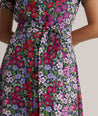 Model is wearing UNTUCKit Annette floral dress. 