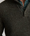 Model is wearing UNTUCKit Barron pullover sweater in green. 