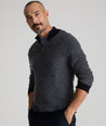 Model is wearing UNTUCKit Birdseye Merino Wool Quarter-Zip Sweater in Heather Navy.