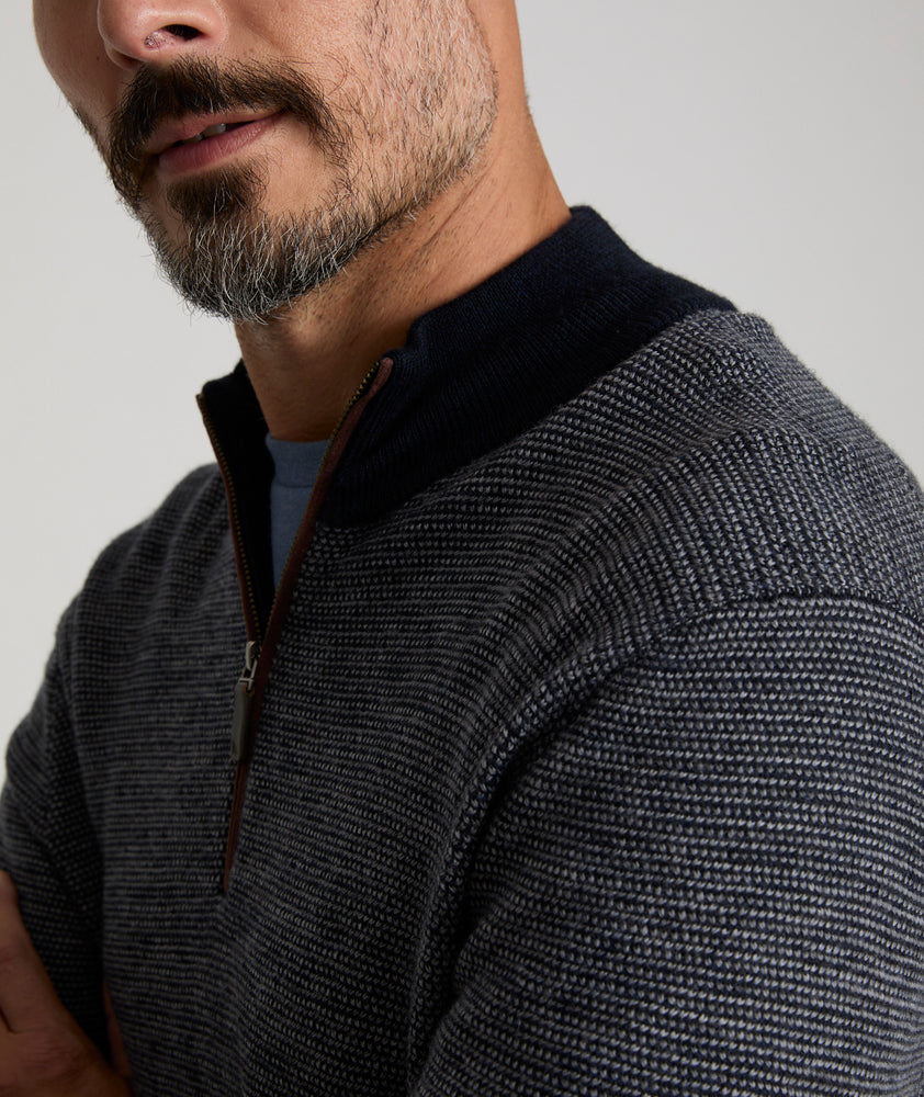 Model is wearing UNTUCKit Birdseye Merino Wool Quarter-Zip Sweater in Heather Navy.