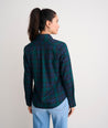 Model is wearing UNTUCKit Belinda shirt in plaid navy. 