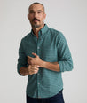 Model is wearing UNTUCKit Wrinkle-Free Performance Flannel Bergstrom Shirt in Green Gingham.