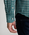 Model is wearing UNTUCKit Wrinkle-Free Performance Flannel Bergstrom Shirt in Green Gingham.