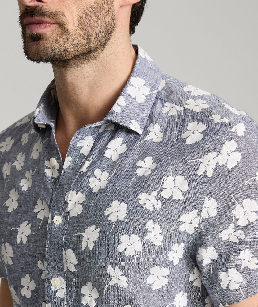 Model is wearing UNTUCKit bonner short sleeve shirt in Chambray Floral.