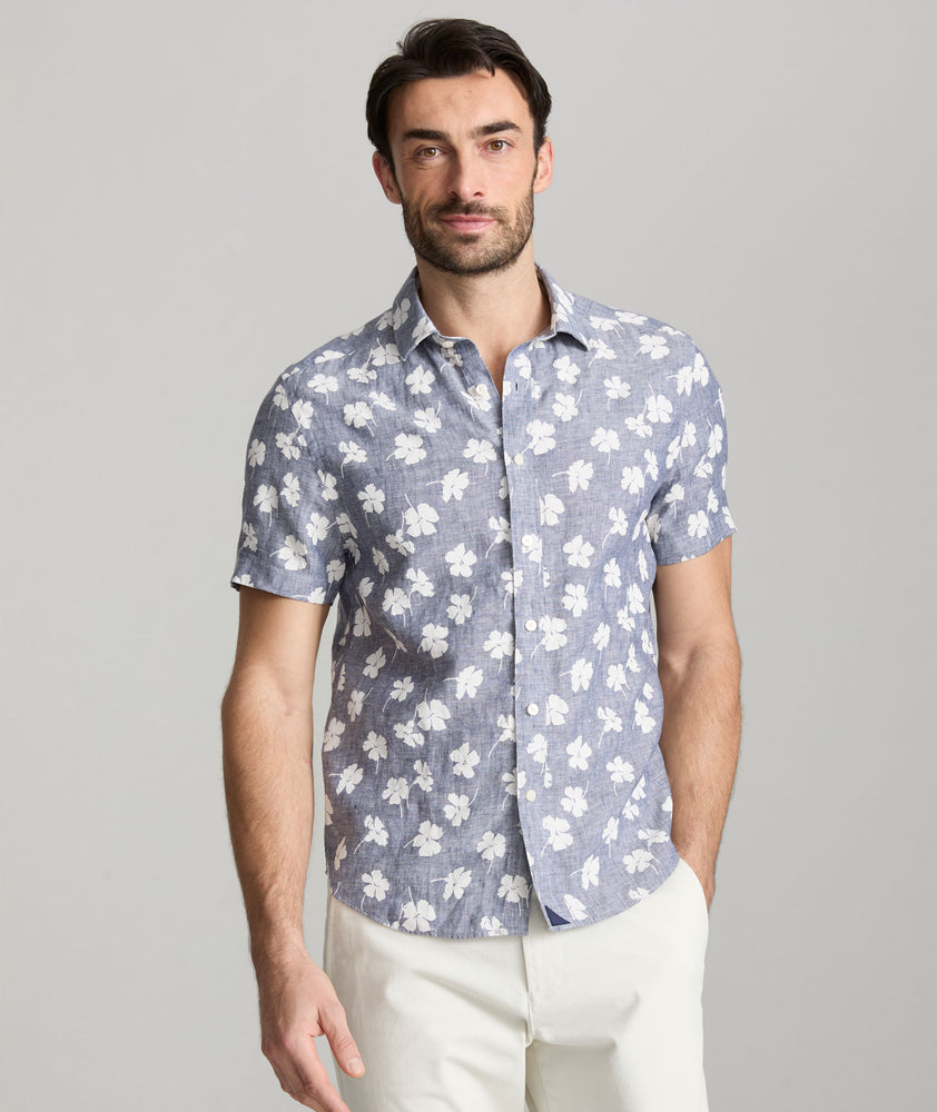 Model is wearing UNTUCKit bonner short sleeve shirt in Chambray Floral.