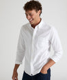 Model is wearing UNTUCKit Bridges shirt in white oxford stretch.