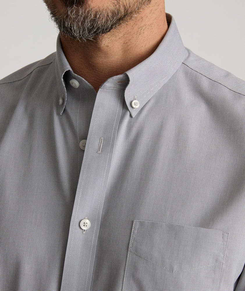 Model is wearing UNTUCKit Cadetto wrinkle-free shirt in castlerock.