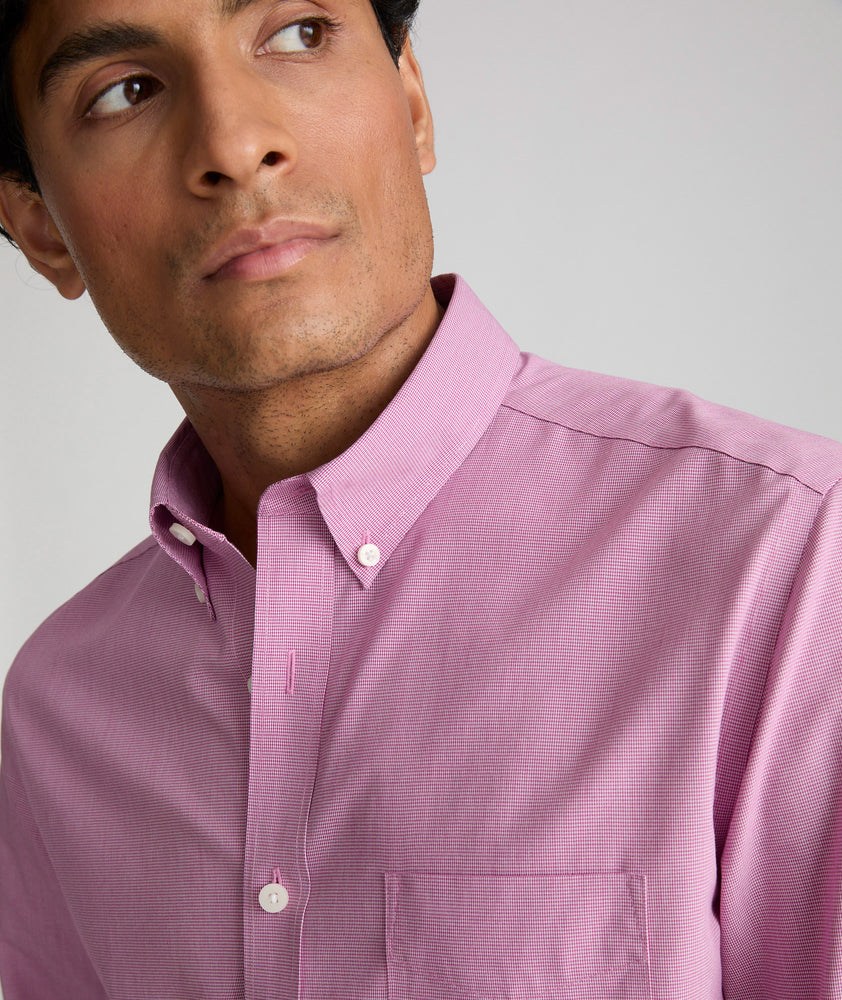 Model wearing an UNTUCKit Mid Red Wrinkle-Free Cadetto Shirt.