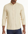 Model is wearing UNTUCKit Wrinkle-Free Cadetto Shirt in Tan. 