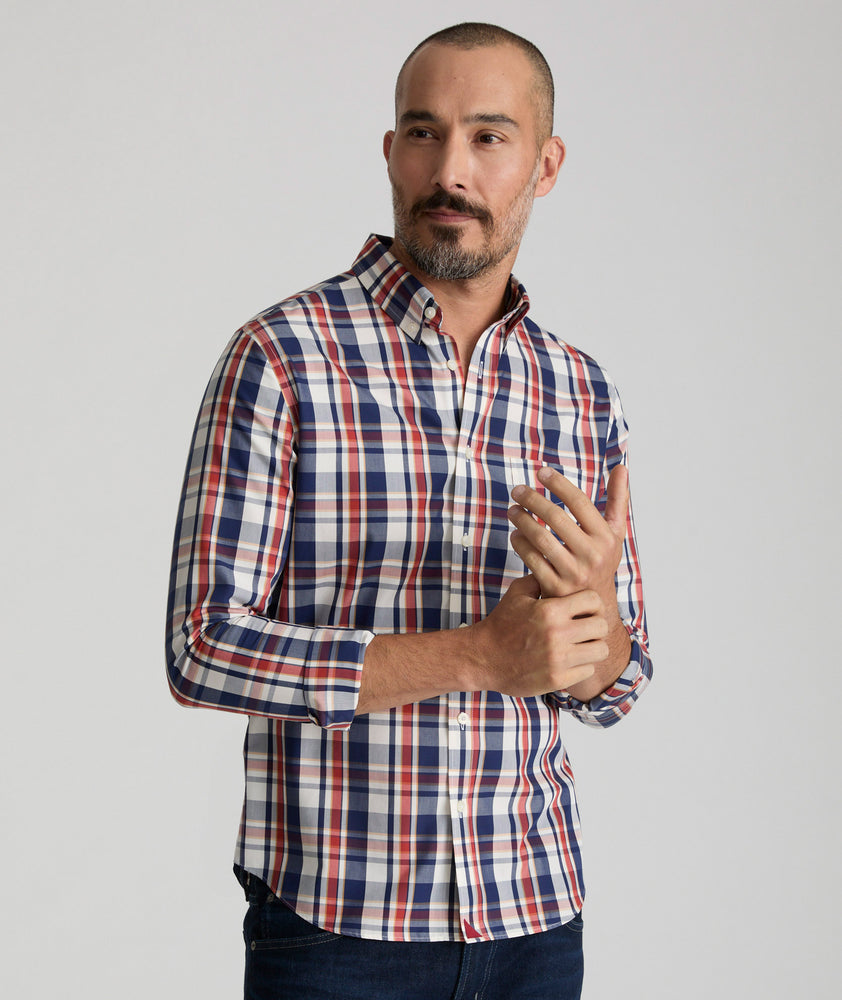 Model is wearing UNTUCKit Caldwell wrinkle-free plaid shirt in red. 