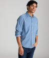 Model is wearing UNTUCKit Caprone Cord Shirt in Faded Blue.