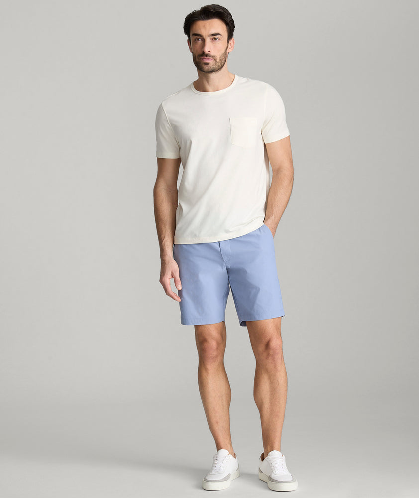 Model is wearing UNTUCKit Chancellor shorts in stonewash.