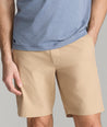 Model wearing UNTUCKit Tan Traveler Shorts.