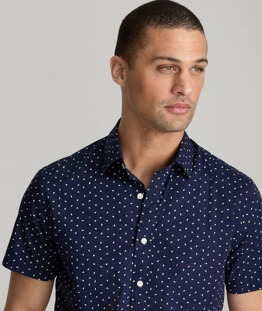 Model are wearing UNTUCKit Cilders short sleeve shirt in navy.