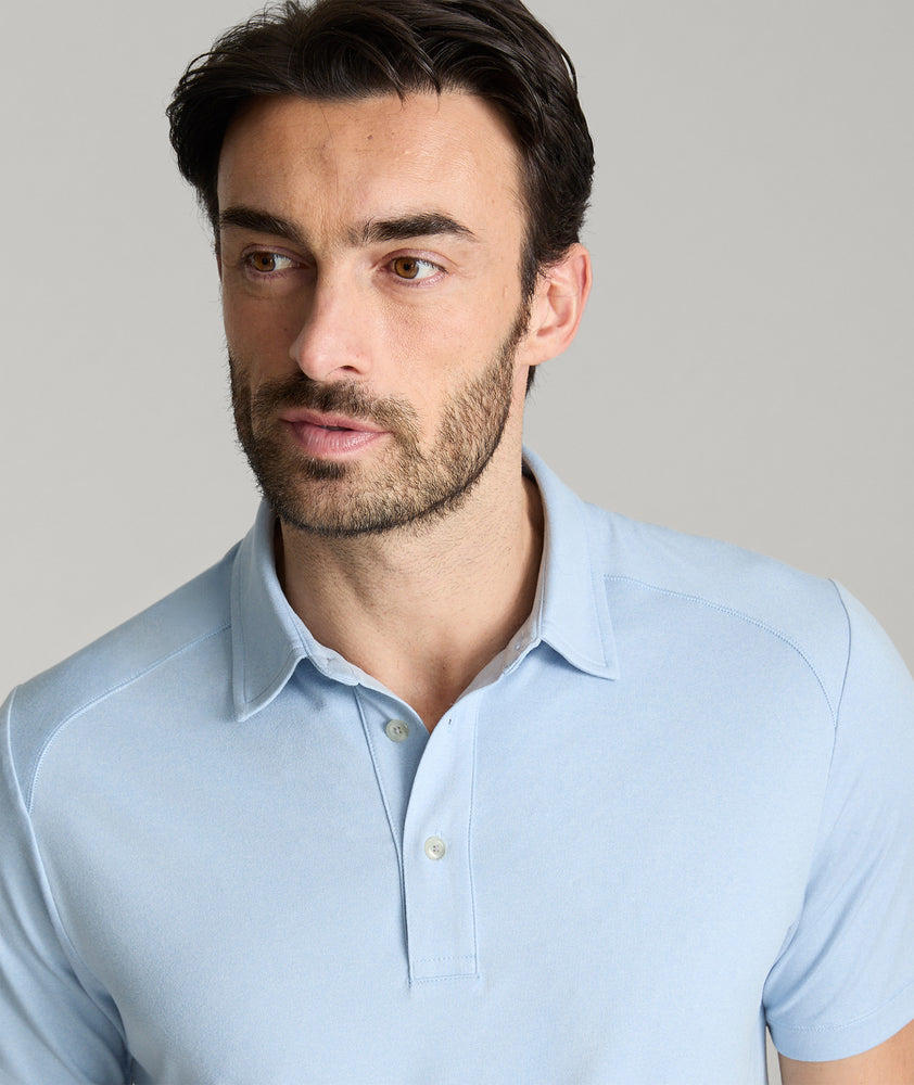 Model is wearing UNTUCKit Clavier performance polo.