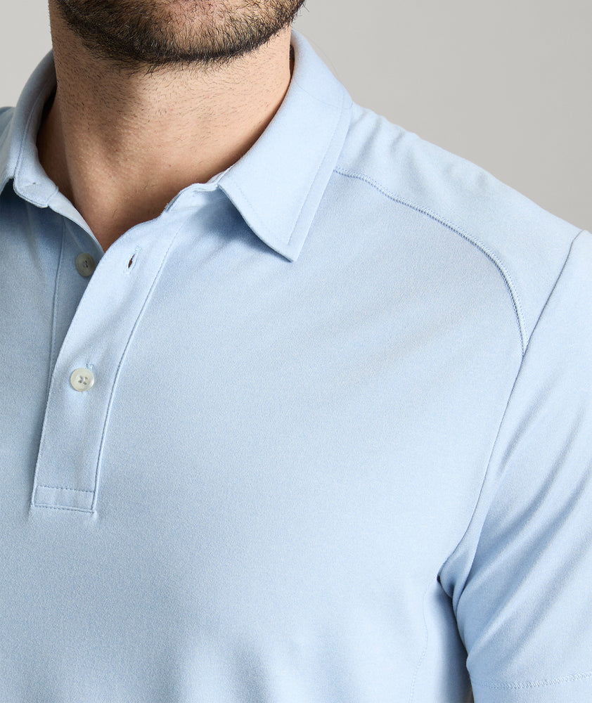 Model is wearing UNTUCKit Clavier performance polo.