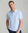 Model is wearing UNTUCKit Day Performance Polo in Placid Blue.