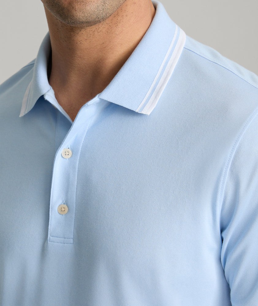 Model is wearing UNTUCKit Day Performance Polo in Placid Blue.