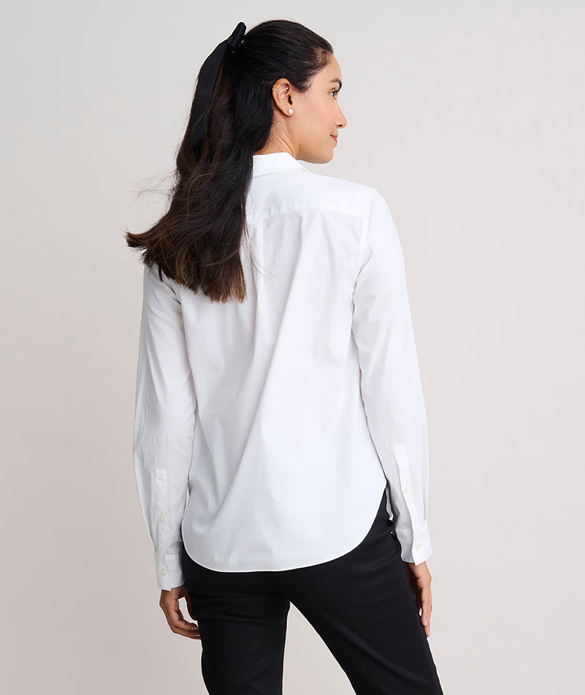 Model is wearing UNTUCKit Dominique shirt in white. 