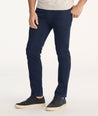 Model is wearing UNTUCKit 5-Pocket Chino Pants in navy.