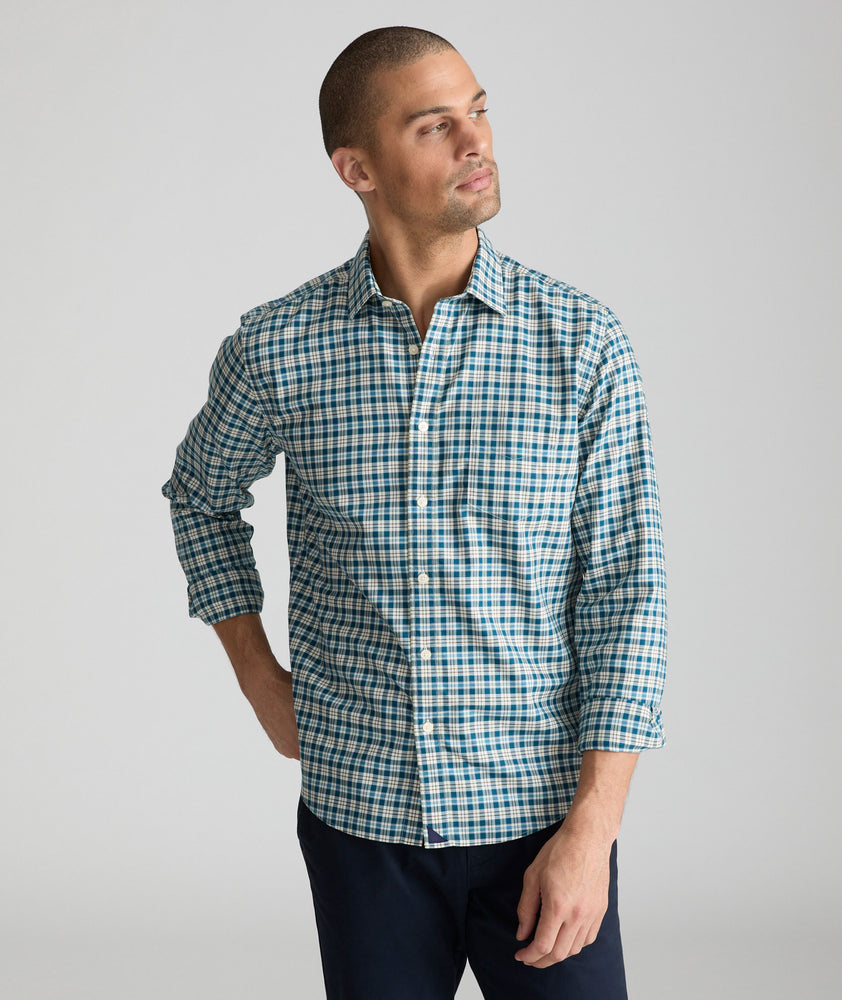 Model is wearing UNTUCKit Wrinkle-Free Elrond Shirt in White & Navy Check.