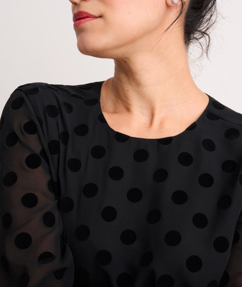 Model is wearing UNTUCKit Polka Dot Textured Eva Shirt.