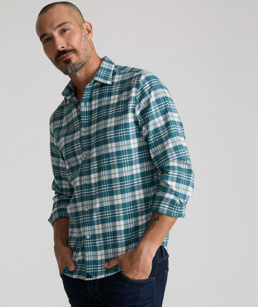 Model is wearing UNTUCKit Wrinkle-Free Performance Flannel Ferney Shirt in teal plaid.