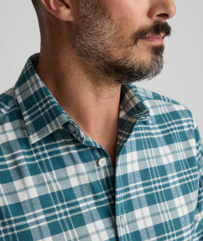 Model is wearing UNTUCKit Wrinkle-Free Performance Flannel Ferney Shirt in teal plaid.