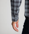 Model is wearing UNTUCKit Plaid Flannel Shirt  in Gray & Light Blue Plaid | Fair Trade Certified™. 