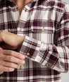 Model is wearing UNTUCKit Plaid Flannel Shirt White Grounded With Maroon Plaid | Fair Trade Certified™.