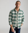 Model is wearing UNTUCKit Plaid Flannel Shirt in White Grounded With Green Plaid | Fair Trade Certified™.