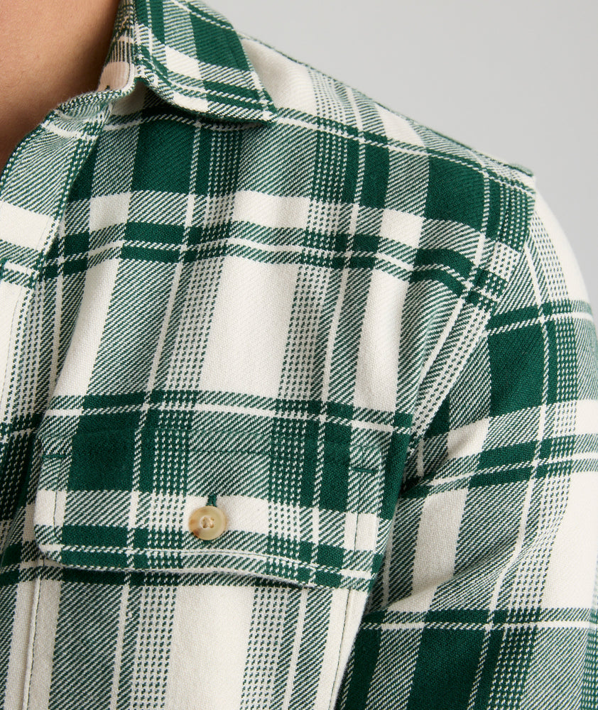 Model is wearing UNTUCKit Plaid Flannel Shirt in White Grounded With Green Plaid | Fair Trade Certified™.