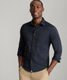 Model is wearing UNTUCKit gironde shirt in black. 