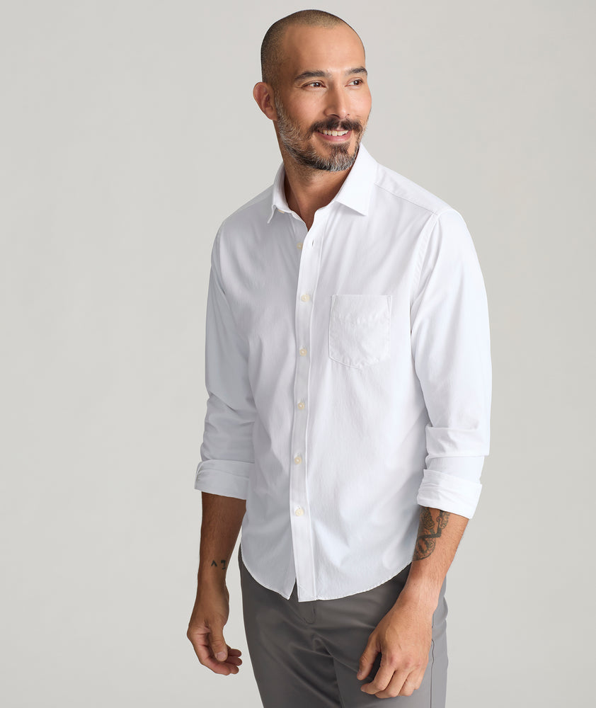 Model is wearing UNTUCKit Gironde shirt in white.