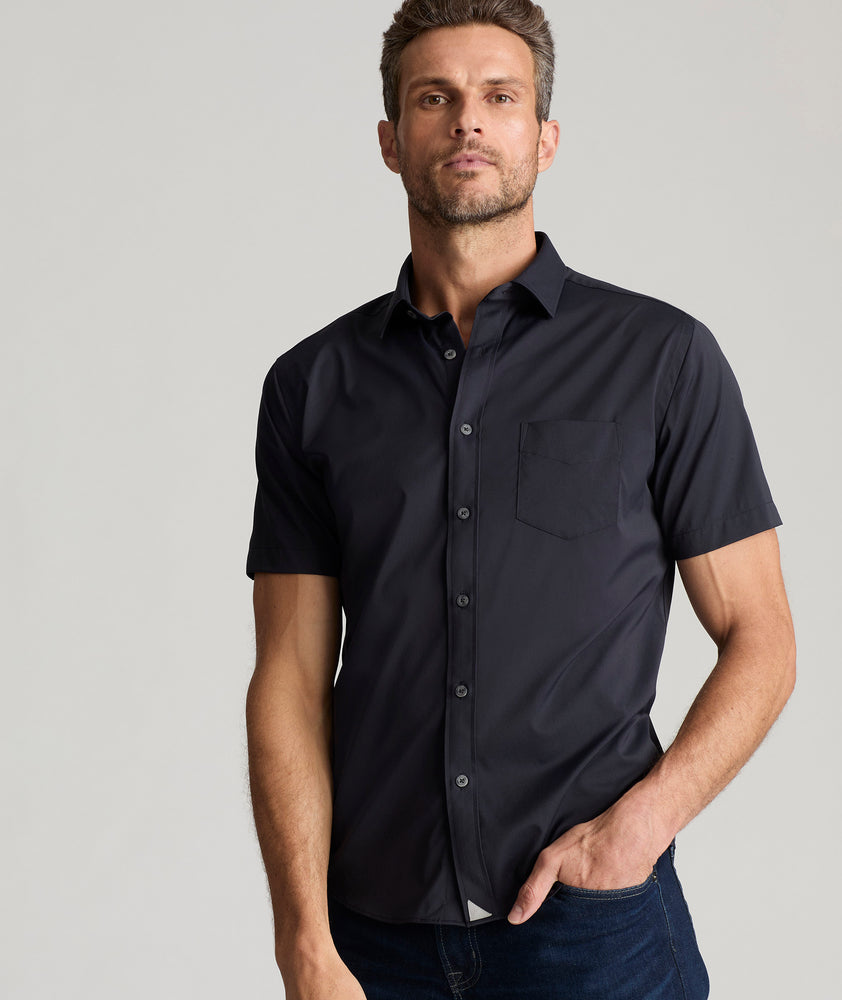 Model wearing an UNTUCKit Black Wrinkle-Free Performance Short Sleeve Gironde Shirt