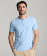 Model is wearing UNTUCKit glera tencel Placid Blue henley. 