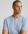 Model is wearing UNTUCKit Glera henley in eventide.