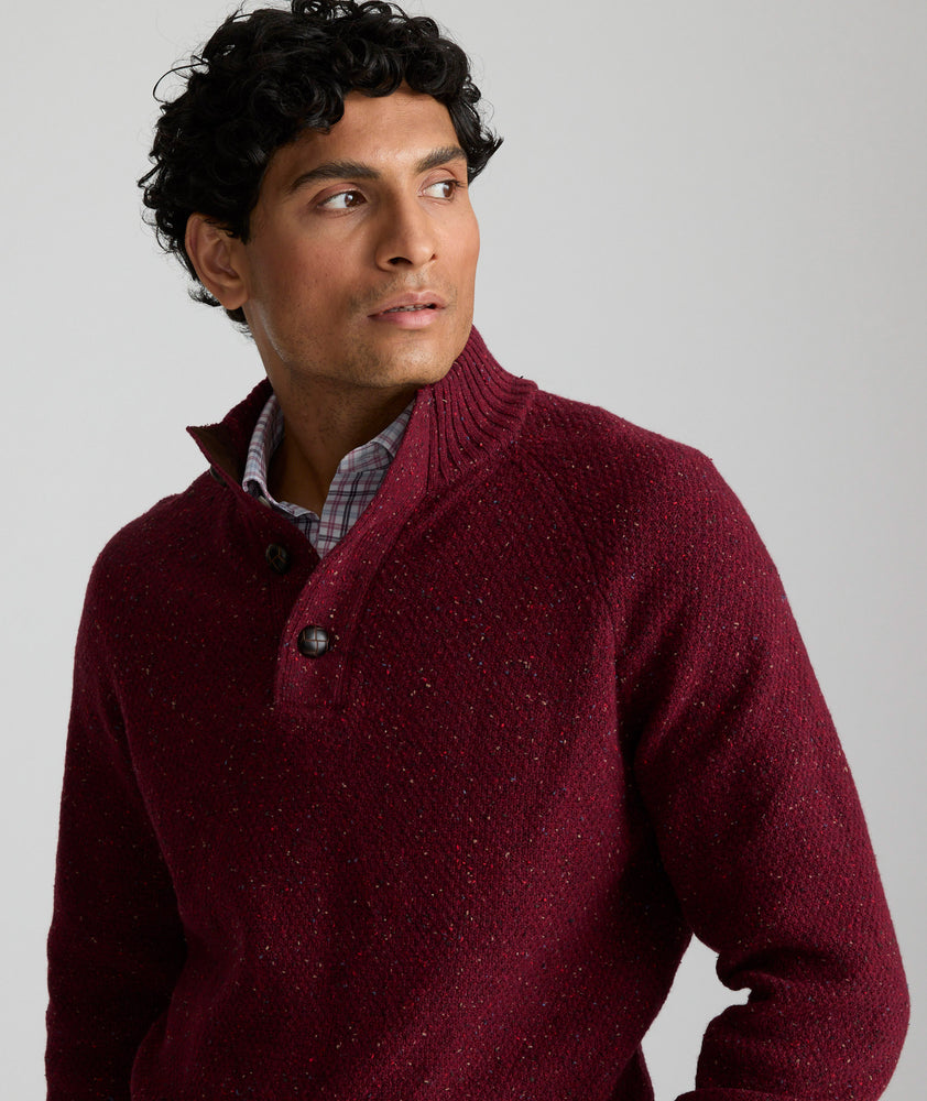 Model is wearing UNTUCKit Button-Neck Donegal Sweater in Burgundy.