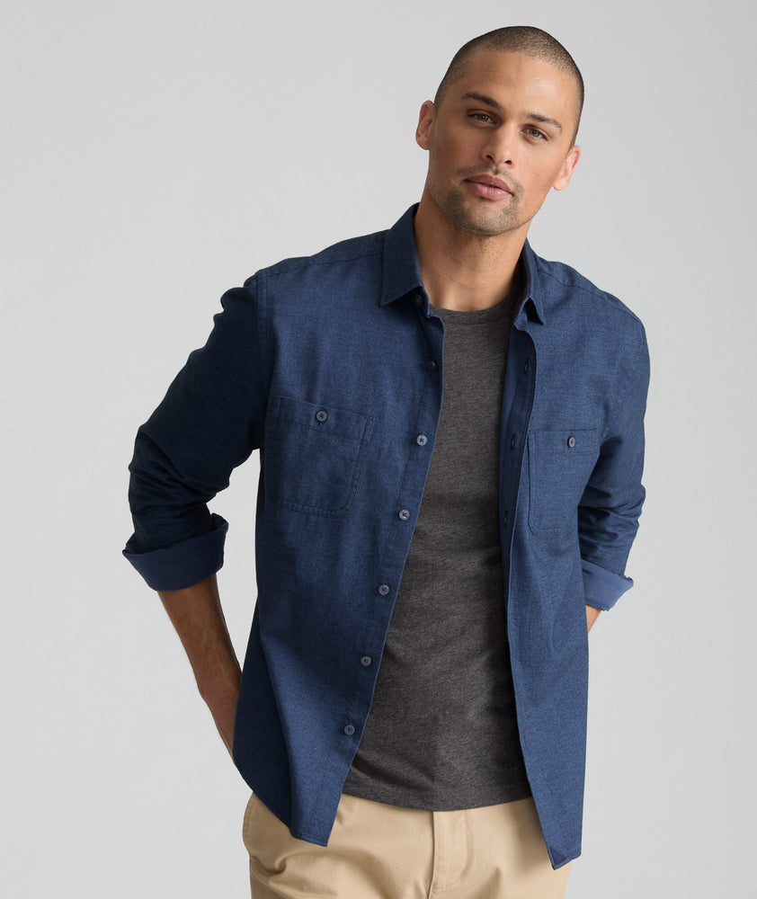 Model is wearing UNTUCKit Flannel Hemsworth Shirt in blue.