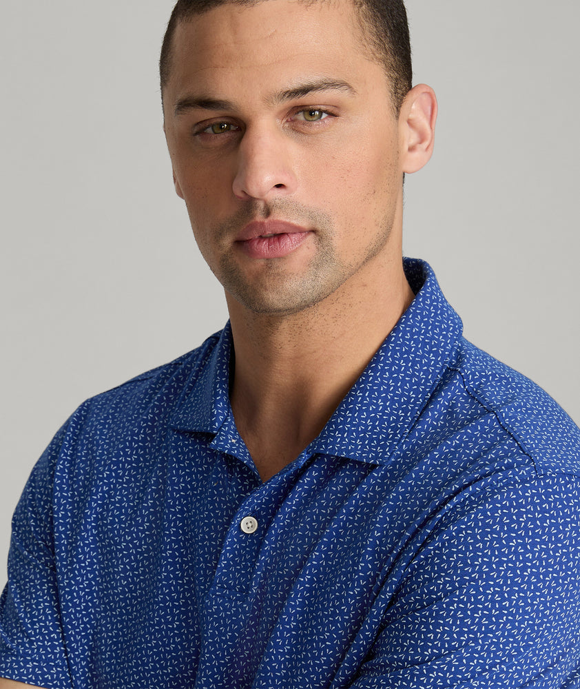 Model is wearing UNTUCKit Herrera Printed Performance Polo in Archroma.