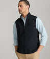 Model is wearing UNTUCKit inman vest in black.